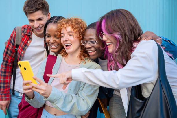 istock Students having fun with mobile phones creating content on social media. 2179491687