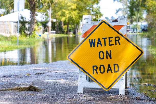 istock Sign warns about road flooding 2179492172