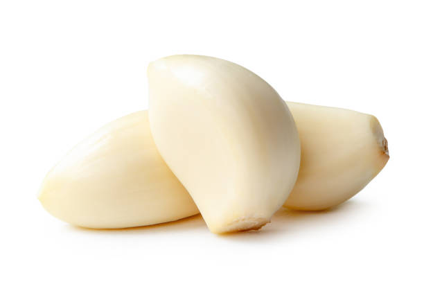 istock Side view of peeled garlic cloves in stack isolated on white background with clipping path 2179493591
