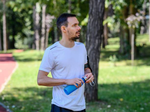istock Sporty young man drinking water 2179505704