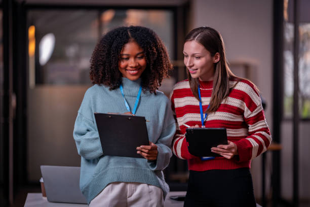 istock Two women discuss, discuss, work on presenting new project ideas, analyze marketing plans and business investments to make it successful. 2179509544