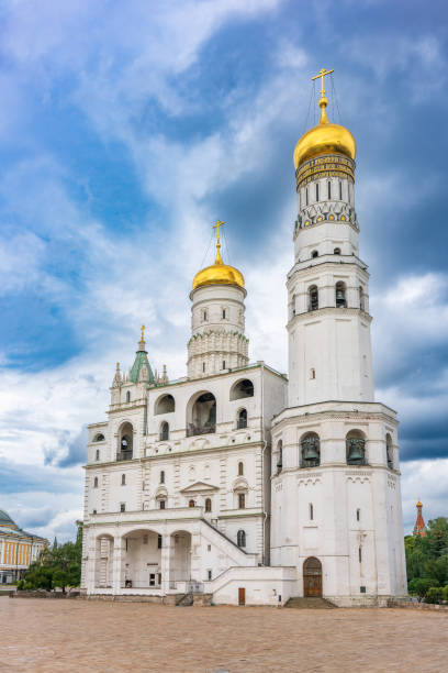 istock Ivan the Great Bell Tower, with Assumption Belfry on the right in Moscow Kremlin. Blue sky background with sunbeams 2179509598
