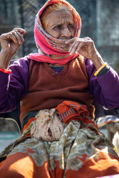 Cropped shot of a senior woman holding a cane in a retirement home