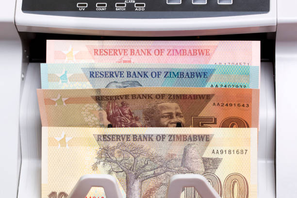 istock Zimbabwean dollar in the counting machine 2179511648