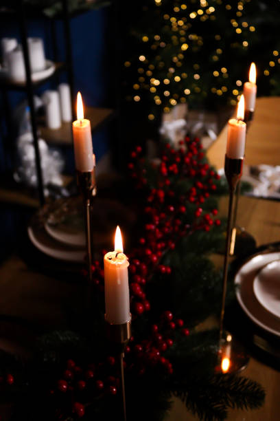 istock Christmas dinner table in the background a Christmas tree with garlands. festive mood 2179513634
