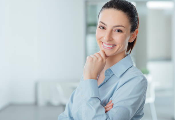 istock Beautiful young woman posing with hand on chin 2179514914