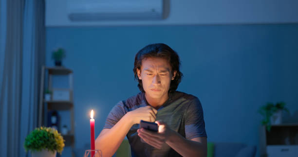 istock asian man with power outage 2179517662