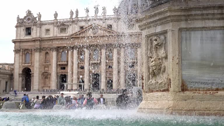 Europe, Italy, Rome 2023 - tourists and Catholic Christian faithful visit St. Peter's Square, seat of the Vatican and the residence of Pope Francis - tourist attraction and sightseeing
