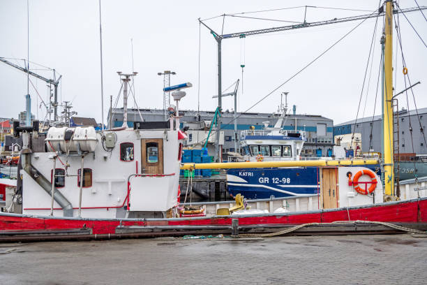 Ilulissat, Jakobshavn, Greenland, Denmark - August 28th 2024:  Traditional fishing boat moored in the natural harbor where it is part of the the fishing industry which are very important for the Greenlandic economy