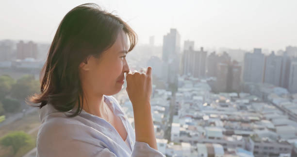 istock woman cover nose against smell 2179528131