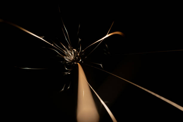 sparks from the grinder glowing in the dark straight ahead