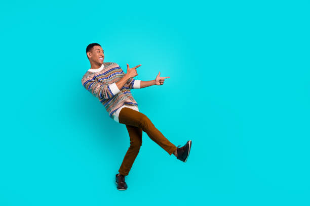 istock Full body portrait of nice young man direct fingers empty space wear pullover isolated on turquoise color background 2179530179
