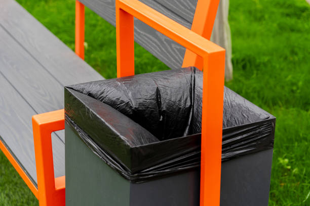 istock A modern bench featuring a built-in garbage container with a black liner sits on lush green grass, showcasing an aesthetic approach to waste management in public spaces 2179532284