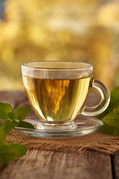 istock A cup of herbal tea with fresh melissa or lemon balm leaves on a table 2179538758