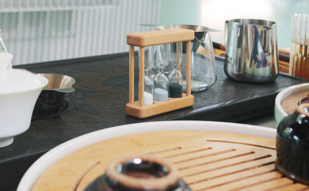 istock Wooden sand timer hourglass on table. 2179539896