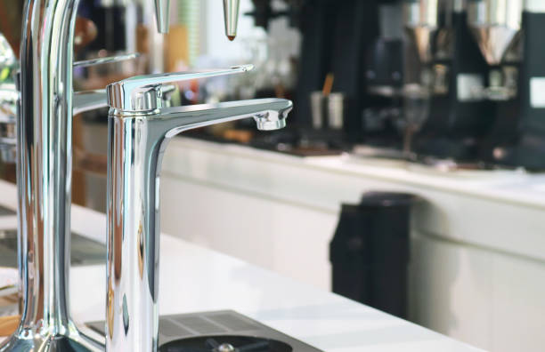 istock Single handle chrome sink faucet on coffee counter. 2179539937