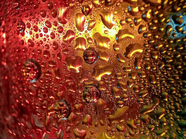 istock Colorful background with water drops on it 2179541286