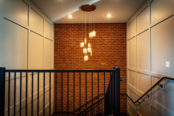 Stairs and glossy wooden floor of beautiful attractive luxury house with white walls