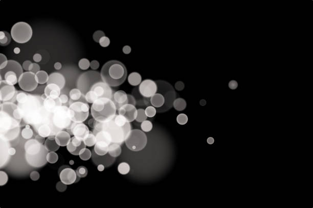 istock White Christmas bokeh, glowing light, confetti and spark overlay texture for your design. 2179555389