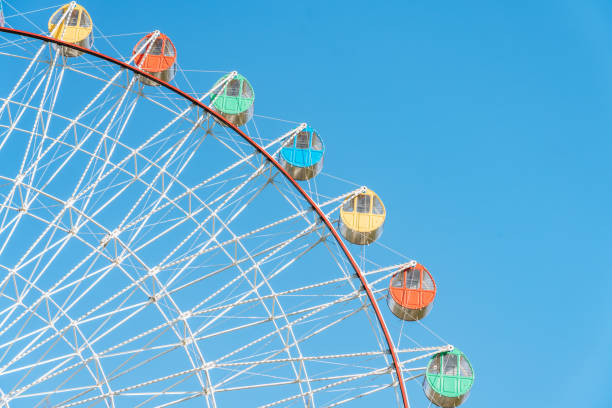 istock Close up of Ferris wheel under blue sky 2179556321