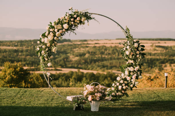 Beautiful round wedding arch. Beautiful round wedding arch. Wedding arch decorated with fresh roses. country wedding arches stock pictures, royalty-free photos & images