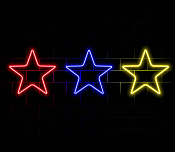 istock Gradient neon star, red-yellow glowing border isolated on a dark background. Colorful night banner, vector light effect. Bright illuminated shape. 2179560604