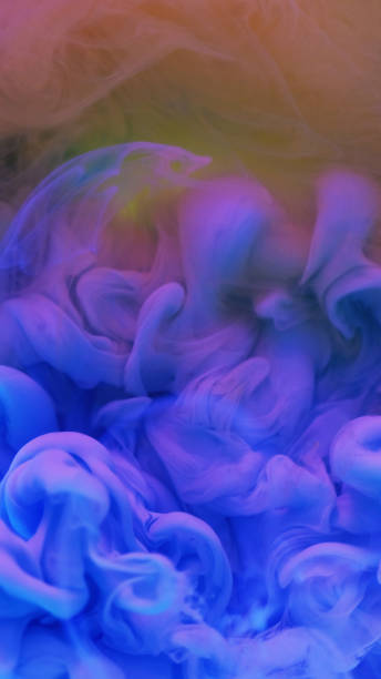 istock Ink drop water neon smoke cloud blue pink vapor 2179565596