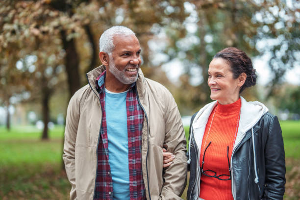 istock Smiling Mature Couple on Leisurely Park Stroll 2179567288