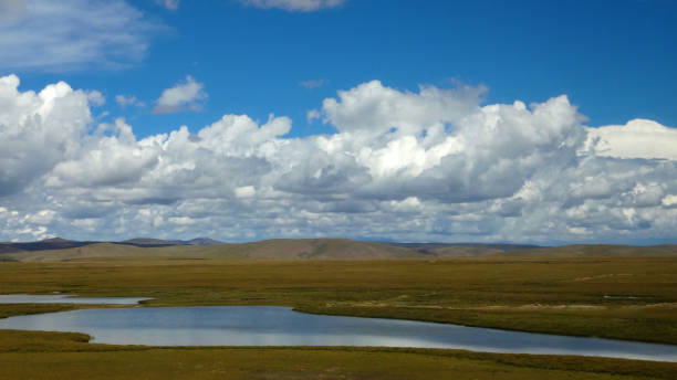istock view of cloud on the plain in suuny day 2179569597