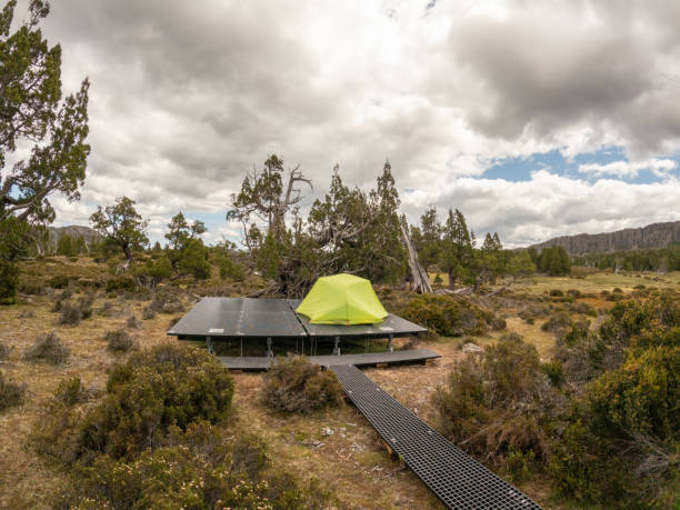 istock Ten pitched on platform in the wild, trekking concept 2179576235