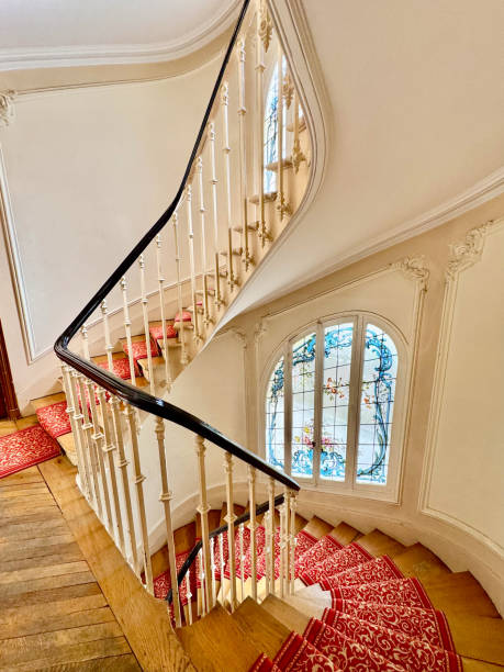 istock Wood stairs with red carpet 2179586701