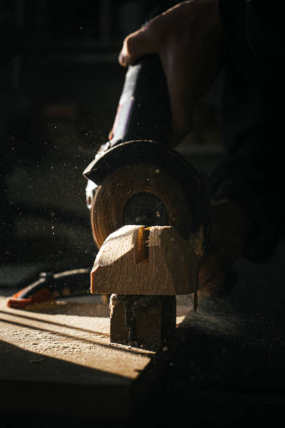 istock Close-up of woodworking process with flying sawdust and tools 2179587170