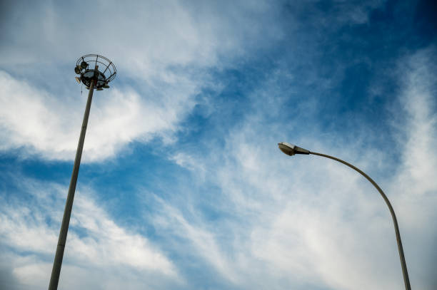 istock High mast lighting on the blue sky with a cloud 2179591741