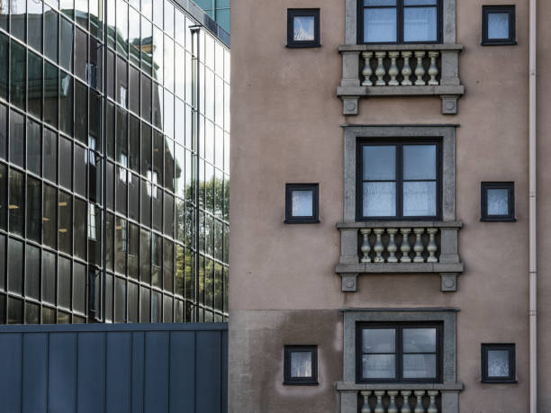 istock Contrast Between Traditional Architecture and Modern Glass Facade in Urban Setting 2179591855
