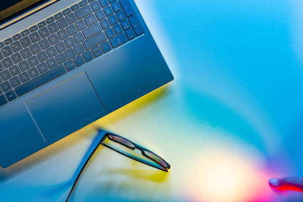 Glasses on laptop, freelancer workplace