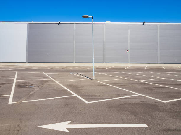 istock Empty parking in front of an aluminium cladding modern building 2179594259
