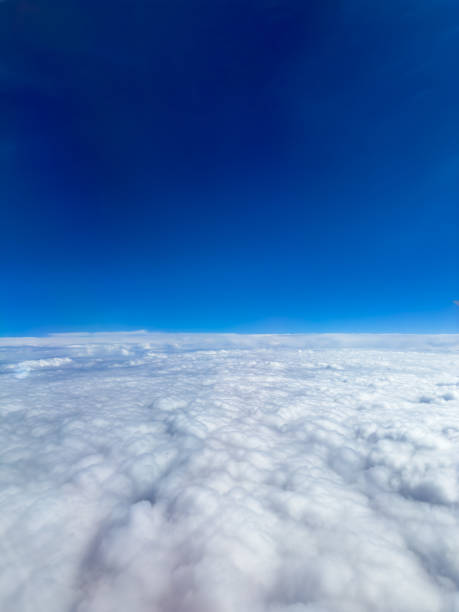 istock Aerial View of Fluffy White Clouds Under a Deep Blue Sky During a Sunny Day 2179595683