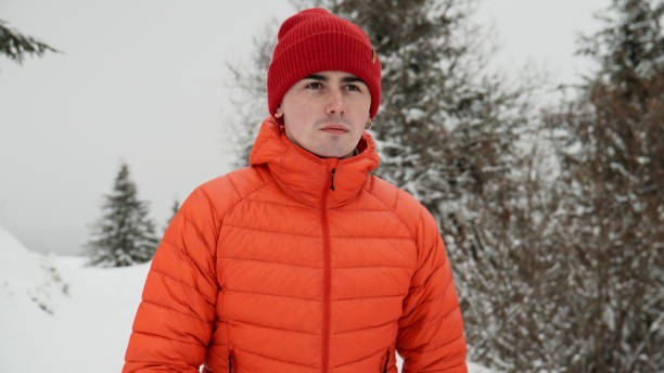 istock Male hiker ascends slope in winter 2179597575