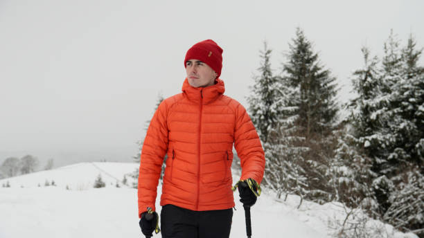 istock Male hiker ascends slope in winter 2179597670