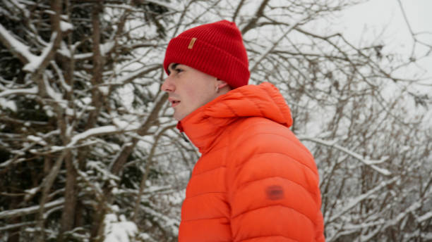 istock Male hiker ascends slope in winter 2179598090