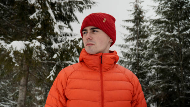 istock Male hiker ascends slope in winter 2179598103