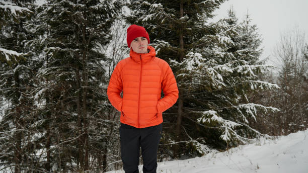 istock Male hiker ascends slope in winter 2179598114