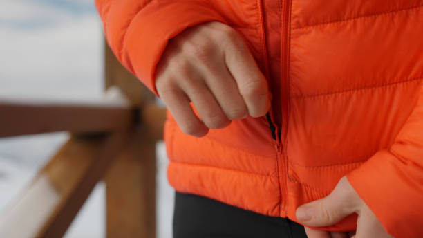 istock Young woman prepares for hike in winter 2179598459