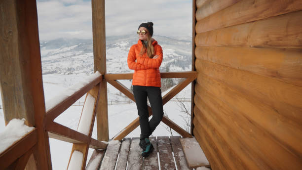 istock Young woman prepares for hike in winter 2179598518