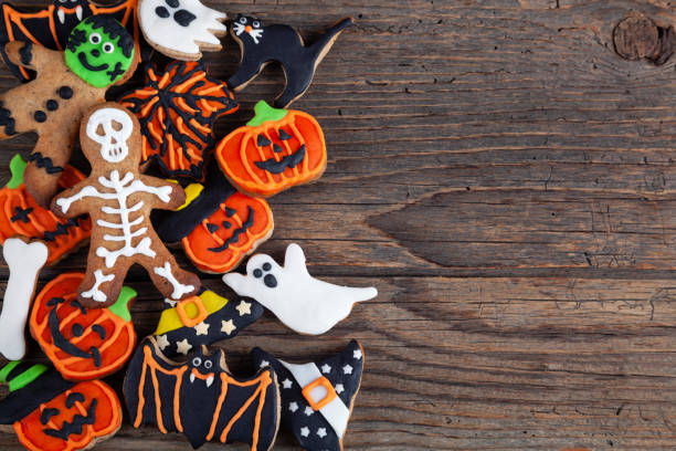 istock Halloween gingerbread cookies on wooden rustic background. 2179598650