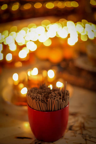 istock Stunning array of glowing candles forming rows and casting warm light, ideal for creating a peaceful and spiritual ambiance. Perfect for meditation, reflection, or romantic settings 2179599220
