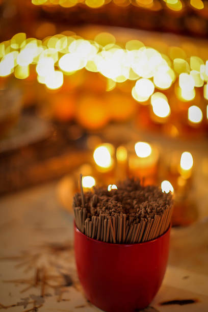 Stunning array of glowing candles forming rows and casting warm light, ideal for creating a peaceful and spiritual ambiance. Perfect for meditation, reflection, or romantic settings
