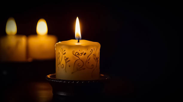 Stunning array of glowing candles forming rows and casting warm light, ideal for creating a peaceful and spiritual ambiance. Perfect for meditation, reflection, or romantic settings