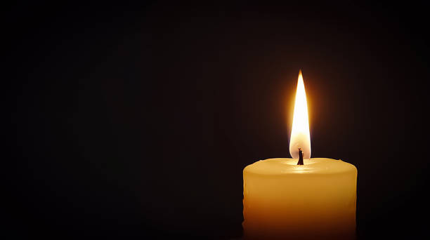 Stunning array of glowing candles forming rows and casting warm light, ideal for creating a peaceful and spiritual ambiance. Perfect for meditation, reflection, or romantic settings