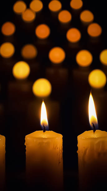 Stunning array of glowing candles forming rows and casting warm light, ideal for creating a peaceful and spiritual ambiance. Perfect for meditation, reflection, or romantic settings